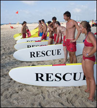 Lifeguard with rescue boards - by Michael W. Fincham