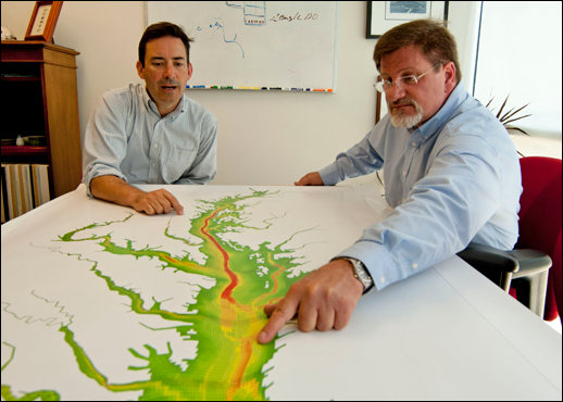 Two modelers look over the model's map. Credit: Michael W. Fincham.