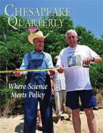 issue cover - Reading the tale of the tape measure are Maryland politicians Bernie Fowler, a former state senator, and Steny Hoyer, current U.S. congressman. The water clarity mark for June 14 at the 2015 Patuxent River Wade-In measured 44.5 inches of light penetration. The Wade-In, which focuses attention on the health of the river, has been conducted yearly since 1988. Credit: Michael W. Fincham