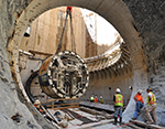 Pieces of a giant tunnel-boring machine are lowered and assembled underground. Credit: DC Water