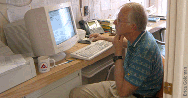Bob Ulanowicz sittiing in front of a computer monitor