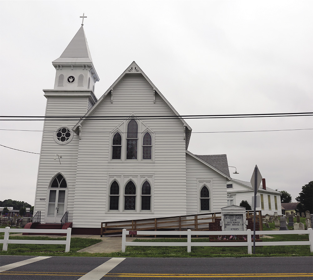 Front of old white church.