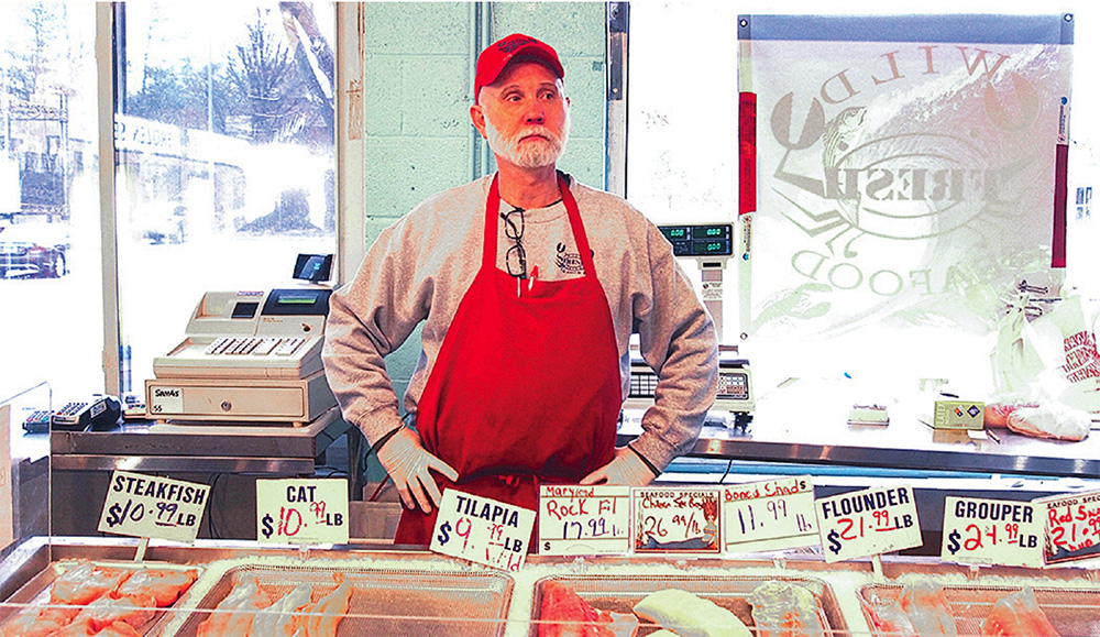 Dave Webb of Wild Seafood mans the last surviving retail shop at Jessup’s wholesale seafood market. Photo, Rona Kobell / MDSG