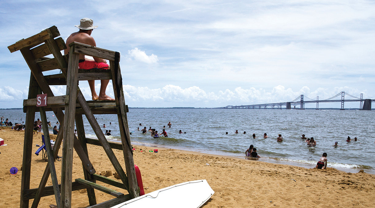 A lifeguard watches swimmers at Sandy Point State Park in Anne Arundel County, Md. Photo, Steve Droter / Chesapeake Bay Program