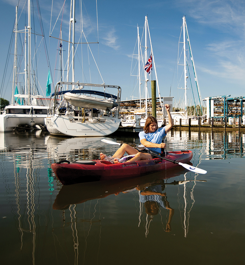Tammy Domanski, a microbiologist at Anne Arundel Community College, uses a secchi disk to test water clarity near the Eastport Yacht Club in Annapolis. Photo, Nicky Lehming / MDSG
