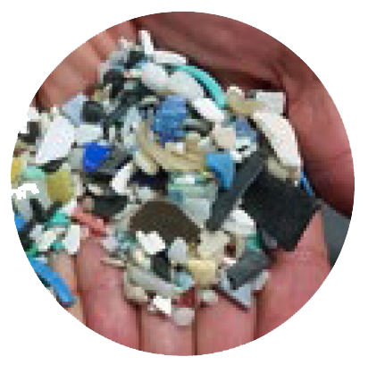 image of multi-colored plastic bits in a person's hand.