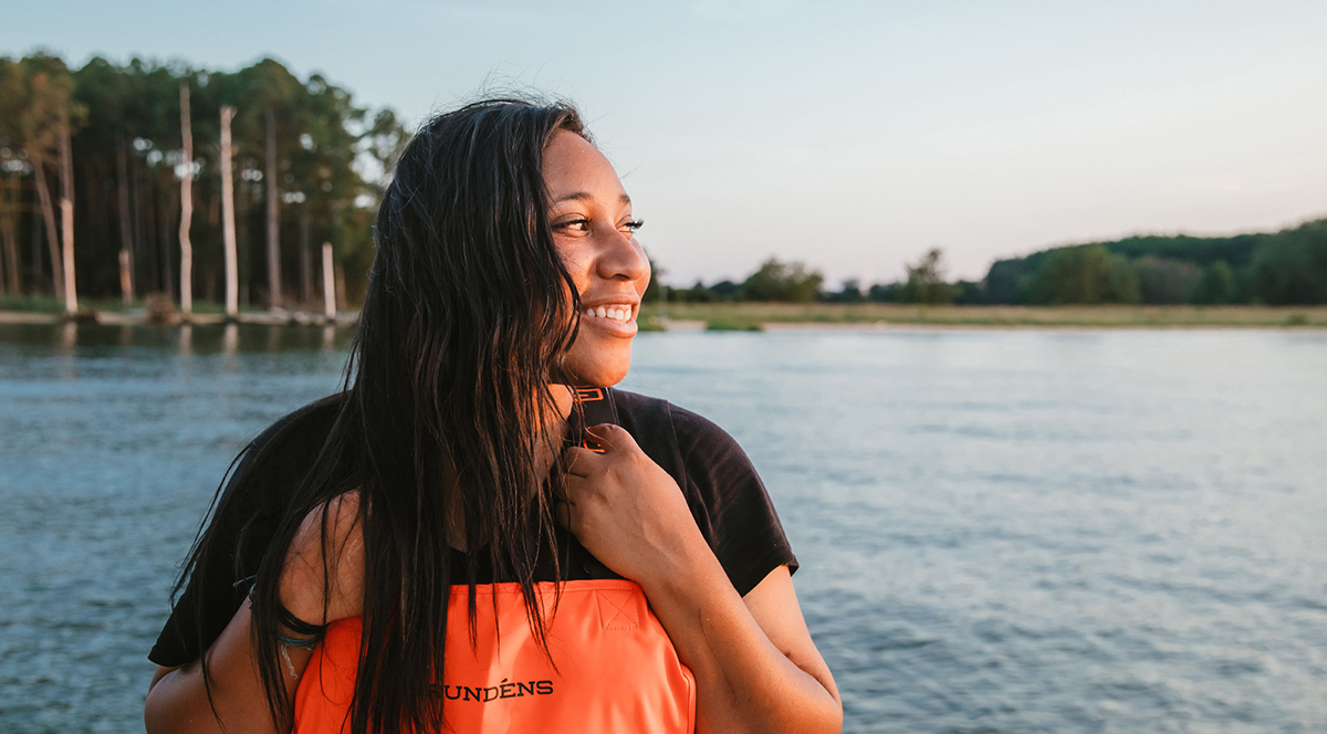 Imani Black posing in front of the Chesapeake.