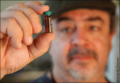 Alan Place holding a vial - photo by Michael W. Fincham