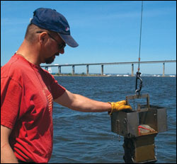 Craig Bruce retrieves a sample - by Erica Goldman