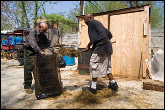 Chapman & Louden shoveling manure - photo by Skip Brown