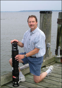 Larry Sanford kneeling next to DIPSTIC