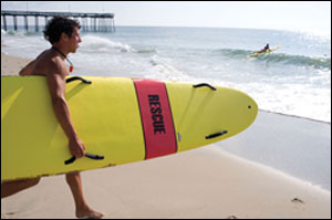 Lifeguard with rescue board - by Michael W. Fincham