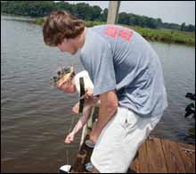 Matthew Ellis gets a lesson from Corsica River Conservancy volunteer Sandy Simpson by Erica Goldman