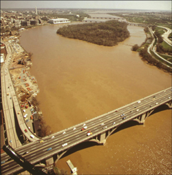 Tropical Storm Agnes sent massive loads of sediment flooding down the Potomac in June; in September the muddy water was still flowing past the Key Bridge in Georgetown. Credit: Dick Swanson from the U.S. Natinal Archives collection