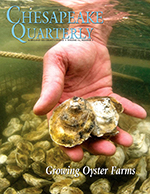 issue cover - A worker with the Hooper Island Oyster Aquaculture Company checks on an oyster held during its growout phase in an underwater cage. The state of Maryland has been giving oyster aquaculture a hand up, hoping to create new businesses and new jobs in the state's Tidewater region. Photograph, Jay Fleming
