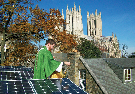  Jered Weber-Johnson blesses rooftop solar panels at St. Alban's Episcopal Church. Photograph, Carlo La Porta