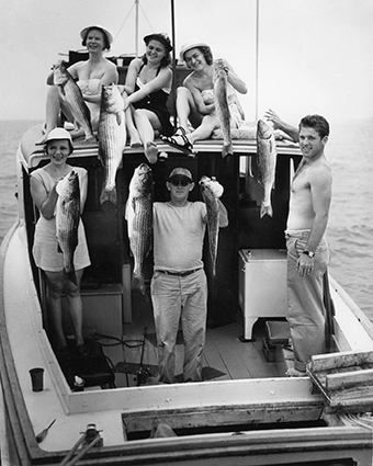 Near Annapolis, a rockfish party celebrates during the Chesapeake Bay Fishing Fair in the early 1950s. Photograph courtesy of Mame Warren