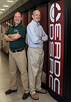 Carl Cerco and Mark Noel next to Garnet, a supercomputer. Photograph, Oscar Reihsmann, U.S. Army Corps of Engineers