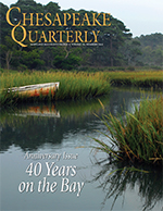 issue cover - A wooden boat finds a final resting place in a wetlands along a Virginia creek. Photograph, Jay Fleming