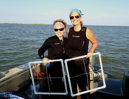 DNR biologist Brooke Landry , who chairs the Chesapeake Bay Program’s SAV Workgroup, stands with colleague Becky Golden.