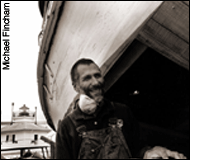 Vlahovich standing next to a skipjack - photo by Michael Fincham