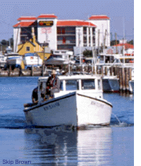 Workboat leaving the dock - by Skip Brown