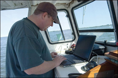 David Kimmel uses a laptop and sensitive instruments to gather data.  Photograph by Sandy Rodgers